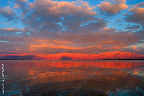 Sunset at the Dead Sea overlooking the mountains of Jordan