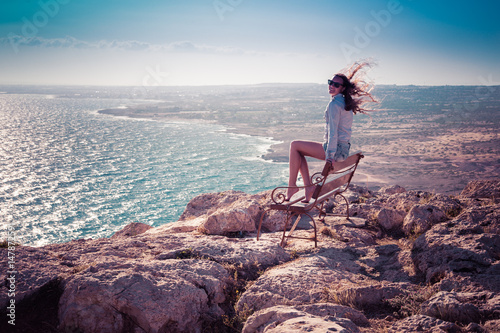 Girl on the top of Cape Greco in Cypruss photo