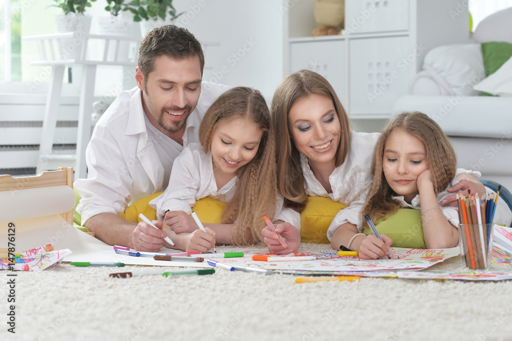 Happy parents with children at home Happy parents with children at home