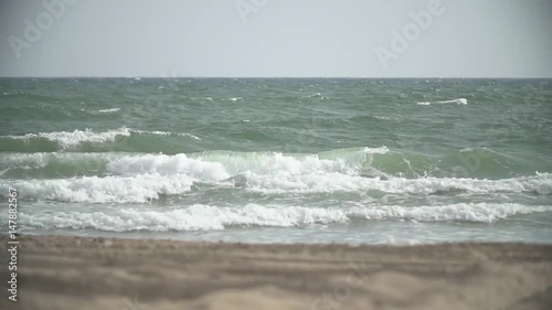 Small waves on the sandy beach