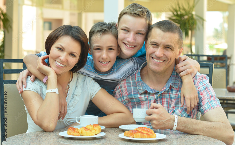 Happy parents with their children eating Happy parents with their children eating