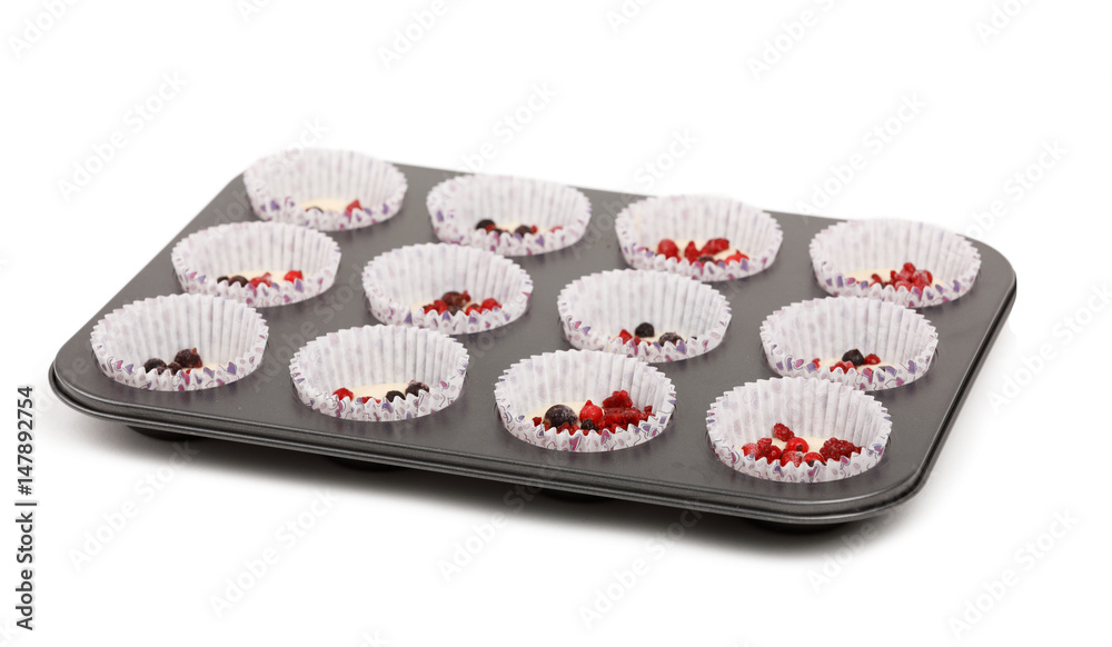 raw homemade Muffin isolated on white background