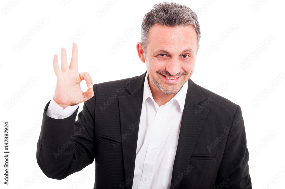 Portait of cool young male doing ok symbol Portait of cool young male doing ok symbol