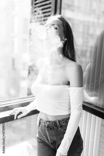 Black-white photo of smoking woman