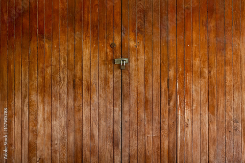 old wood locked door. close panel wooden vintage style home door.