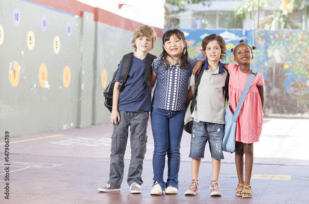 Multiethnic group of schoolchildren playing at school Multiethnic group of schoolchildren playing at school