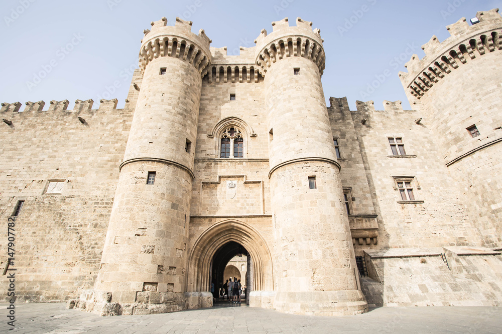 Antique architecture of old town, famous Knights Grand Master Palace, Rhodes, Greece.