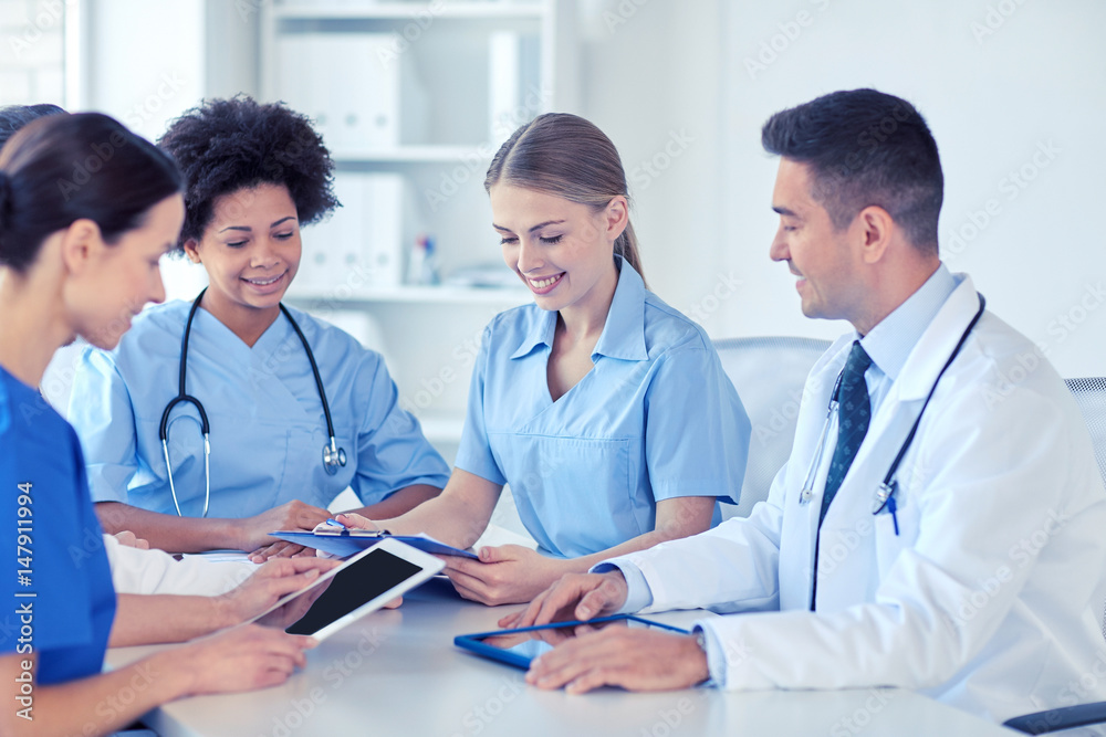 group of happy doctors meeting at hospital office group of happy doctors meeting at hospital office