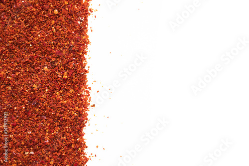 Red chili pepper powder on white background