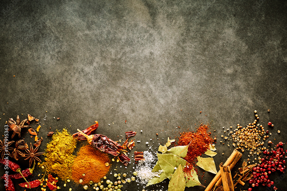 Border of assorted aromatic and pungent spices - obrazy, fototapety, plakaty 