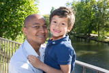 father and son of Hispanic origin take advantage of the park