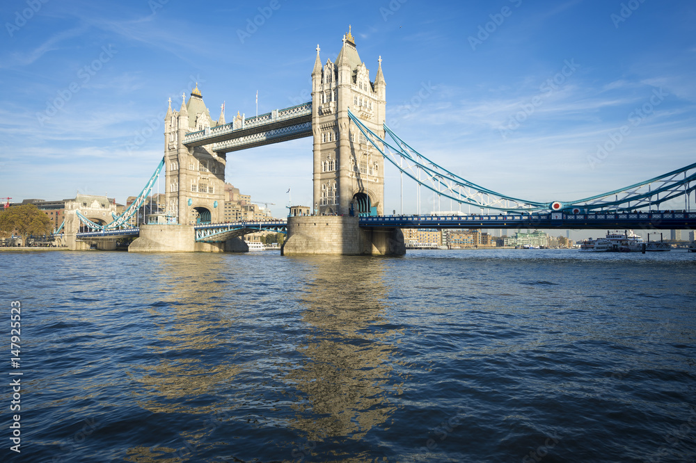 Bright scenic view of the landmark Tower Bridge above the River Thames in London, England 