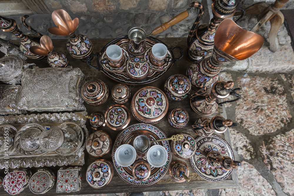 Fototapeta premium Traditional handcrafted copper coffee pots in souvenir shops in Sarajevo. Bosnia and Herzegovina.