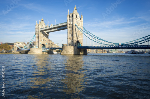 Bright scenic view of the landmark Tower Bridge above the River Thames in London, England 