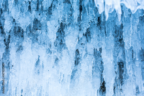 A grotto at Olkhon Island in the Lake Baikal, is filled by icicles in the winter. By the heat in daytime, the icicles melt and slack down then refreeze when temperature drops. photo