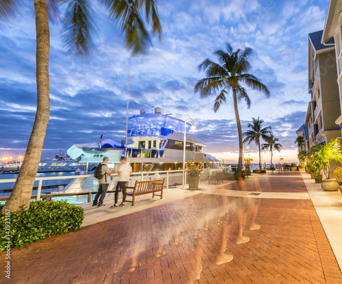 Tourists walking along Mallory Square at sunset, Key West photo