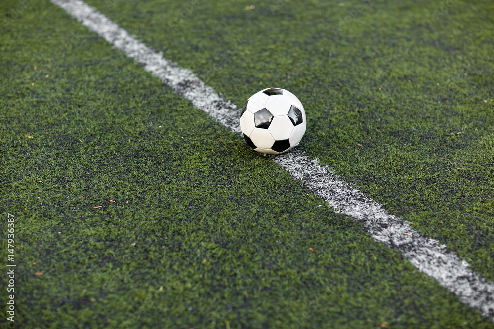 soccer ball on football field marking line soccer ball on football field marking line