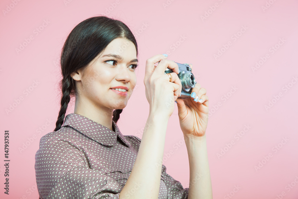 Beautiful young lady in retro style dress with vintage photo camera Beautiful young lady in retro style dress with vintage photo camera