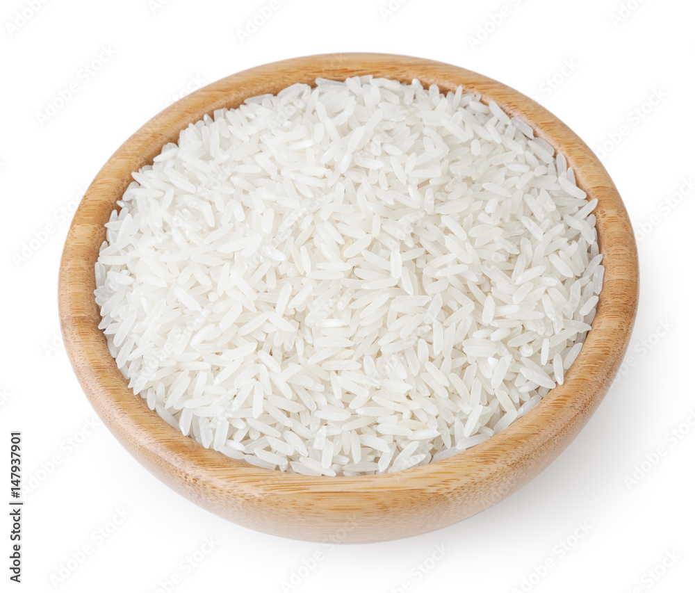 White long-grain jasmine rice in wooden bowl isolated on white background with clipping path White long-grain jasmine rice in wooden bowl isolated on white background with clipping path