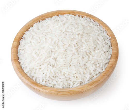 White long-grain jasmine rice in wooden bowl isolated on white background with clipping path