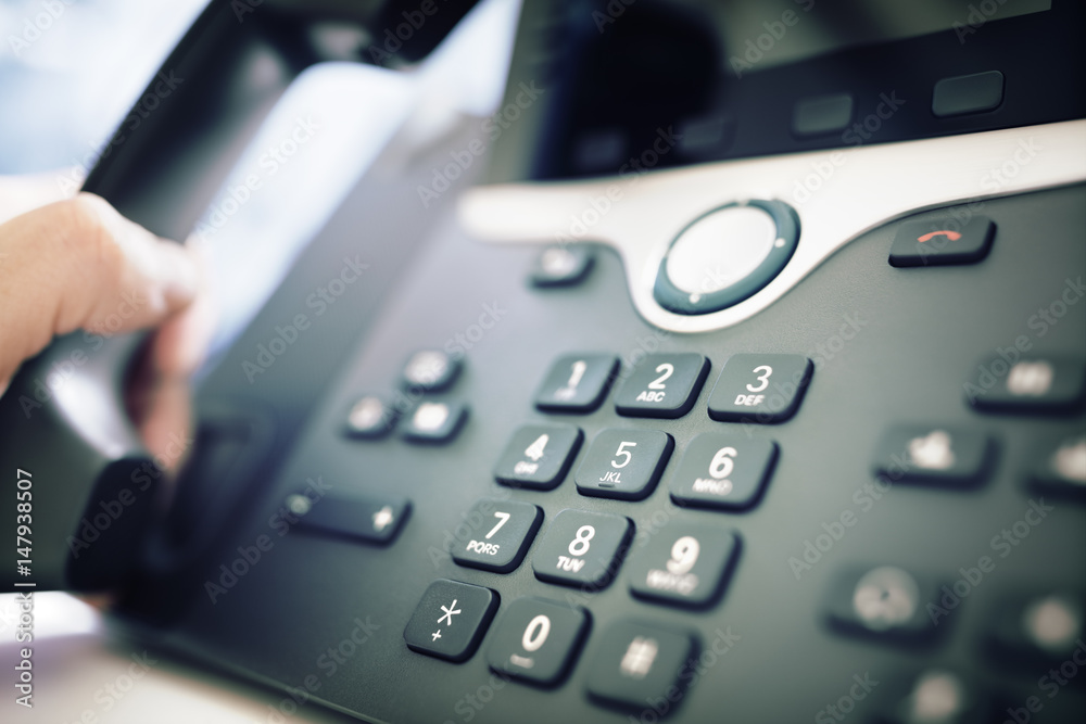 Dialing a telephone in the office Dialing a telephone in the office