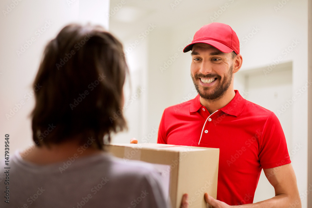 happy delivery man giving parcel box to customer happy delivery man giving parcel box to customer