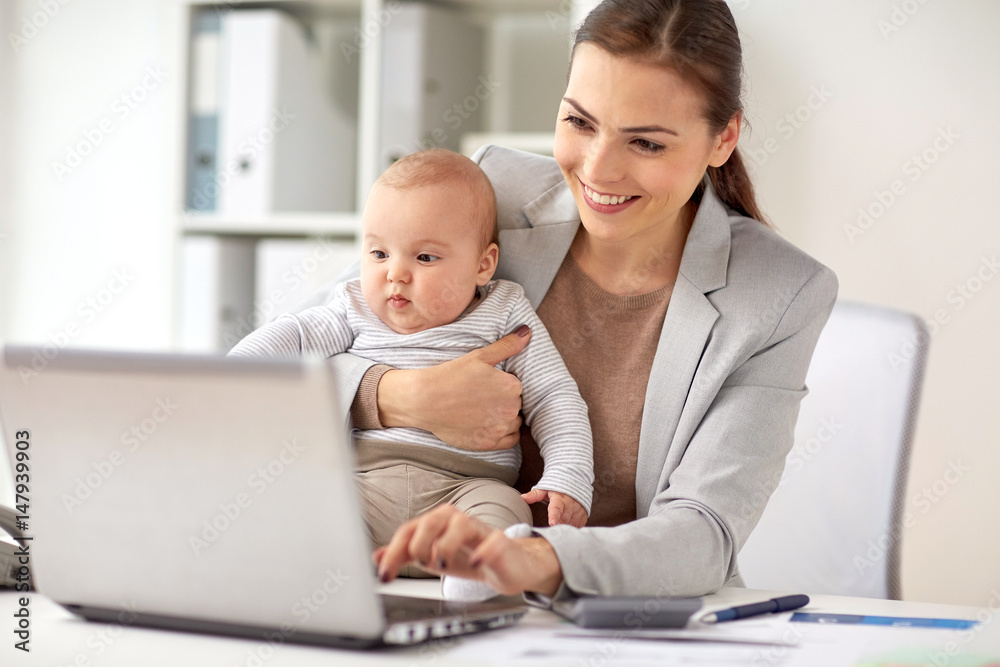 happy businesswoman with baby and laptop at office happy businesswoman with baby and laptop at office