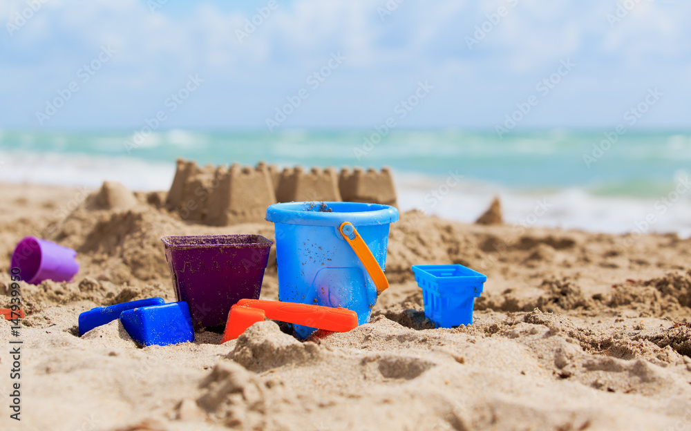 kids toys and castles from sand on beach kids toys and castles from sand on beach