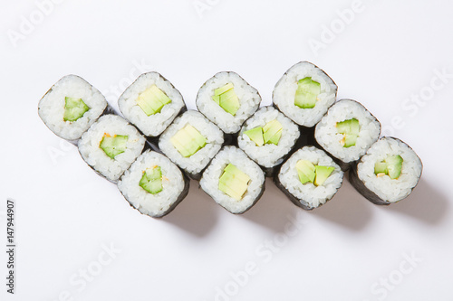 A plate with different kinds of sushi and rolls