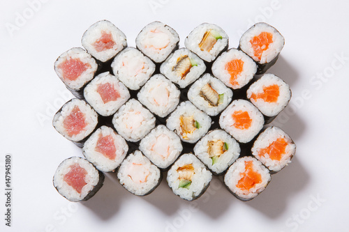 A plate with different kinds of sushi and rolls
