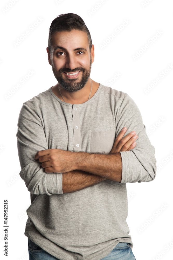 Obraz premium Handsome mature man standing against a white background wearing a bright sweatshirt with a big smile. 