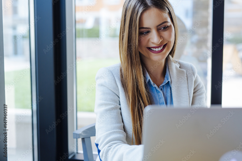 Beautiful Young Woman Working on Laptop