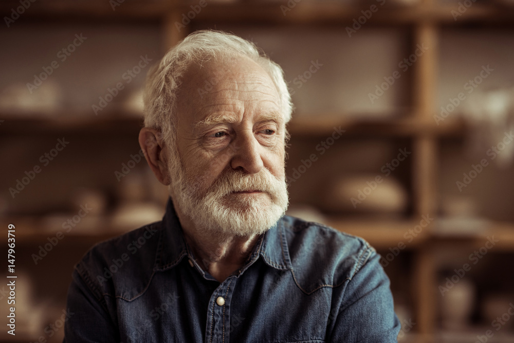 Portrait of senior potter at workshop Portrait of senior potter at workshop