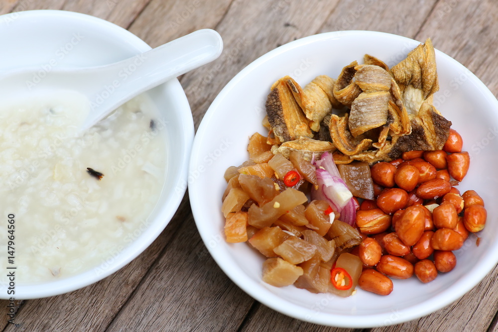 porridge rice gruel with peanuts, Radish and Small dried fish. porridge rice gruel with peanuts, Radish and Small dried fish.