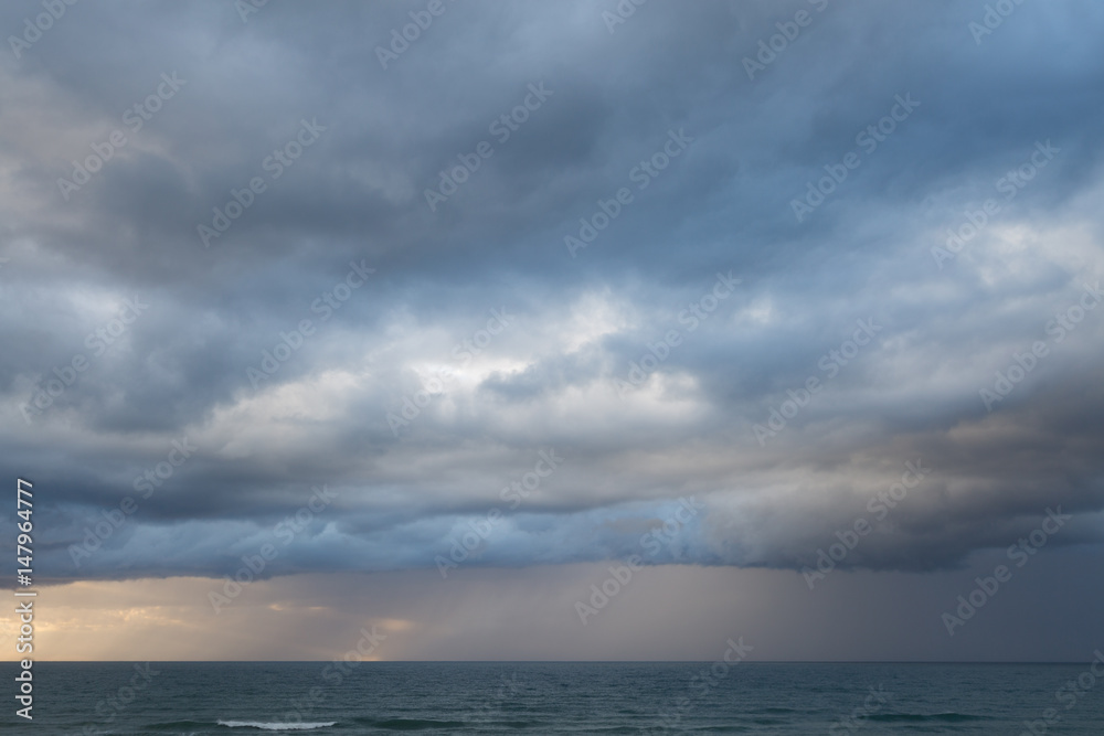 Beautiful stormy clouds and sea. Nice sky and rainy weather.