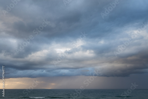 Beautiful stormy clouds and sea. Nice sky and rainy weather. © Turinsky