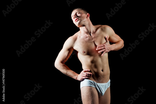 Fotografie muscular man hold hand on chest has heartache