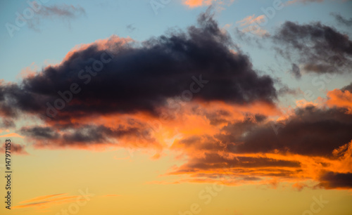 Beautiful bright sunset sky with fluffy clouds © ihorbondarenko