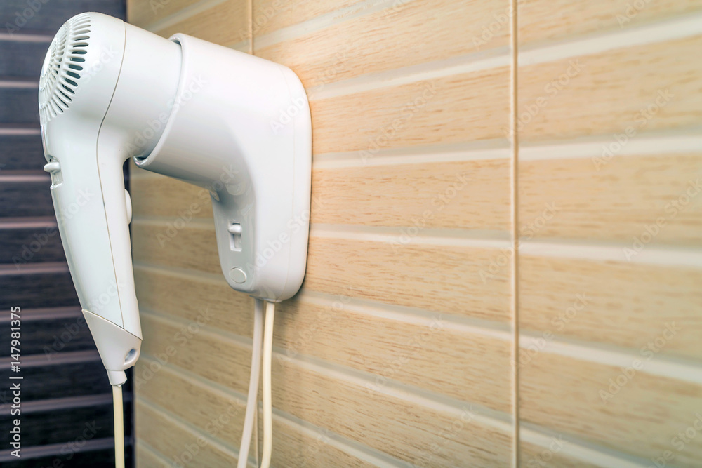 Fototapeta premium Beige hairdryer in bathroom