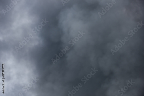 Large black billowing smoke cloud background texture organic pattern © Condor 36