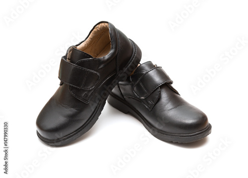 pair of black leather shoe for children on white background