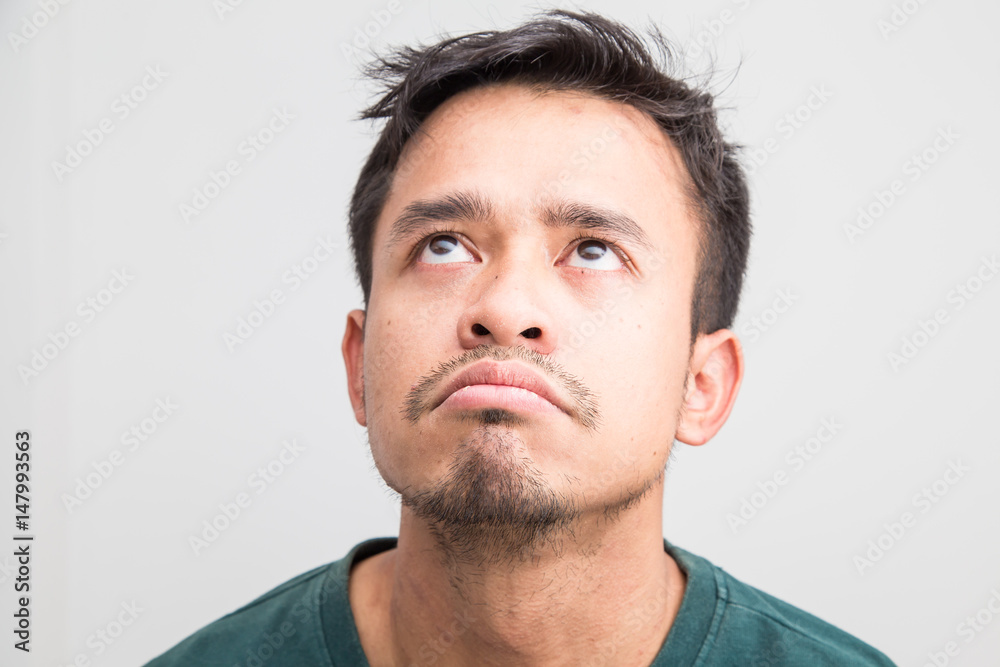 Fototapeta premium Crazy frown asian man on white background, Upset feeling