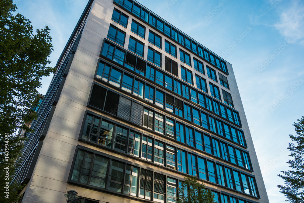 Fototapeta premium modern office building with colored glass facade