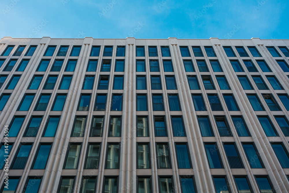 big office building with small blue windows big office building with small blue windows