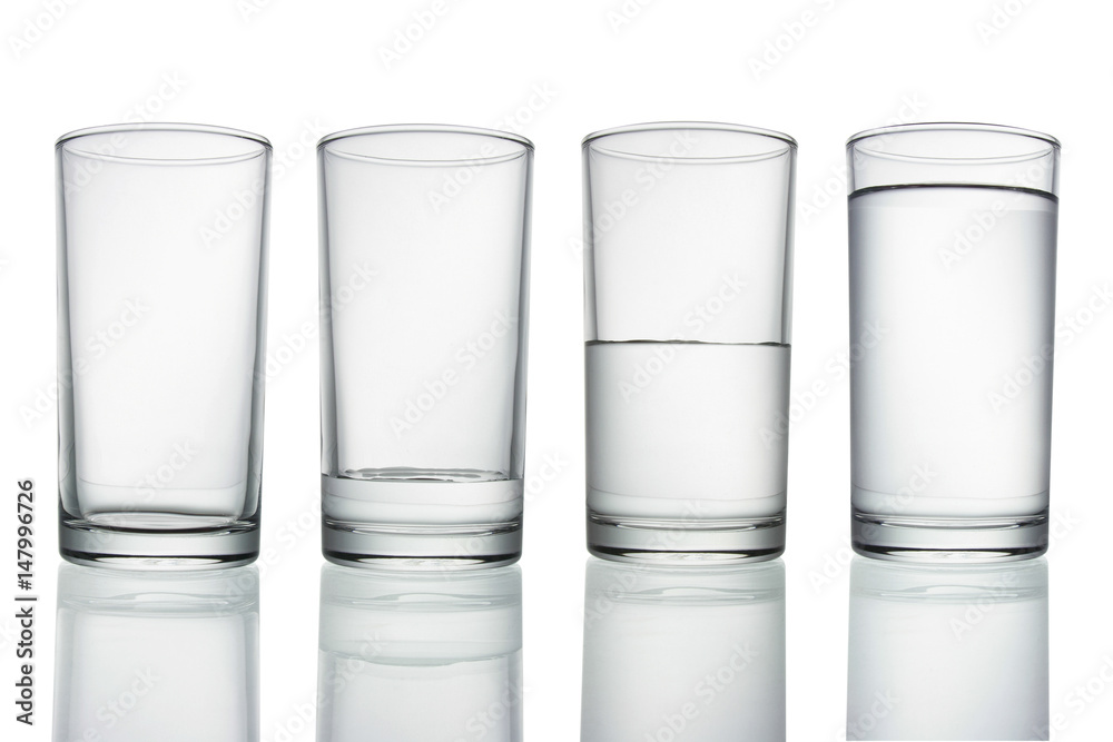 .tall empty, half and full glass of water isolated on white with clipping path included .tall empty, half and full glass of water isolated on white with clipping path included