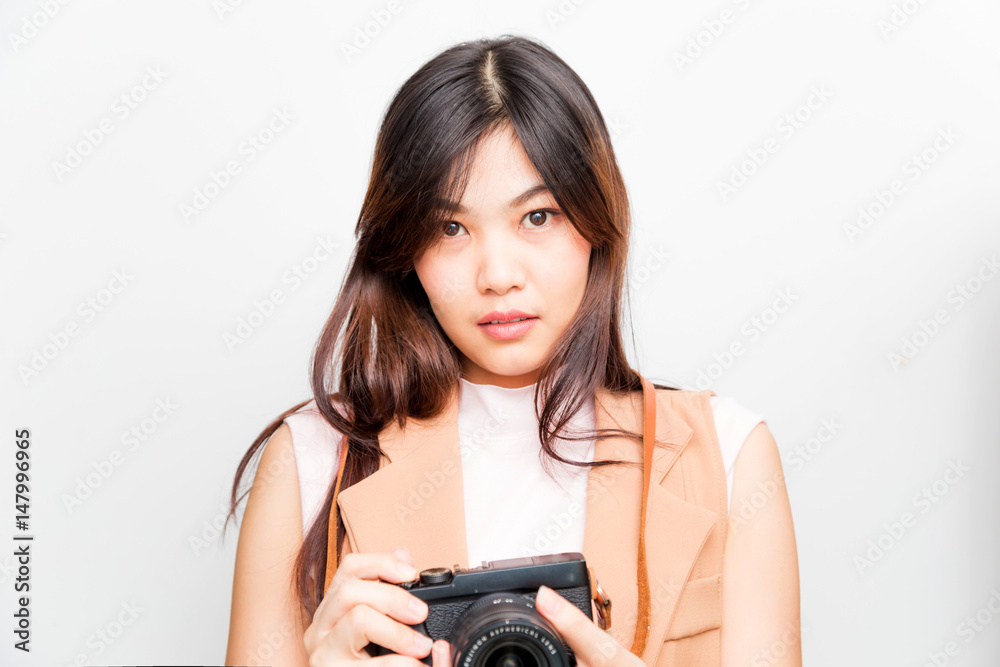Portrait of asian young woman taking pictures on the white background Portrait of asian young woman taking pictures on the white background