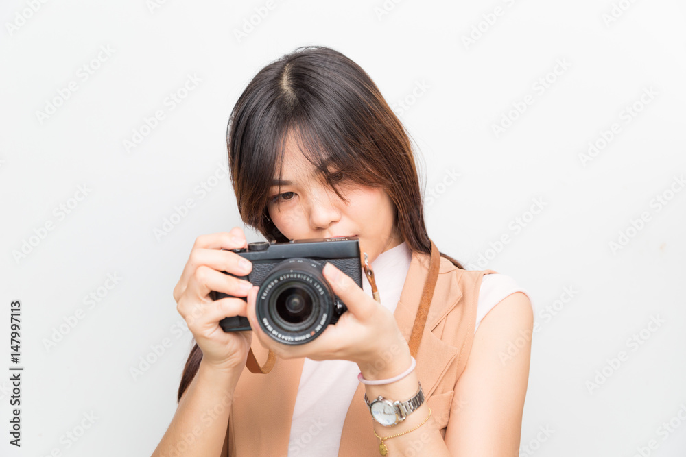 Portrait of asian young woman taking pictures on the white background Portrait of asian young woman taking pictures on the white background