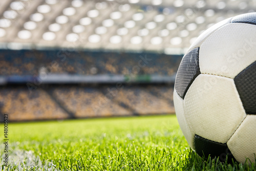 close up view of soccer ball on grass on soccer field stadium photo