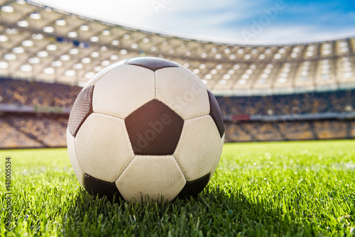 close up view of soccer ball on grass on soccer field stadium © LIGHTFIELD STUDIOS
