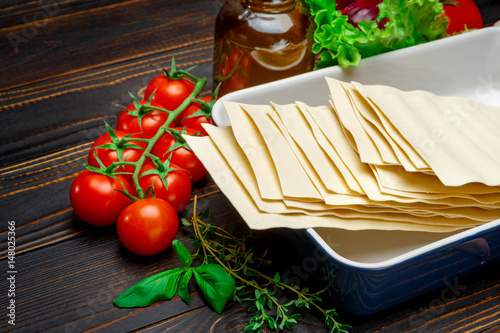 dried uncooked lasagna pasta sheets and ingridients